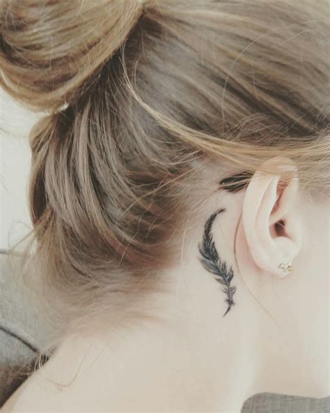 Dragon Tattoo. . Behind the ear tattoos feather